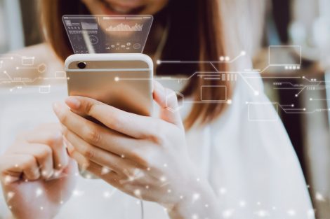 Women using a smartphone in the display and technology advances in stores. Take your screen to put on advertising.